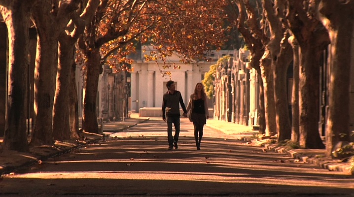 Couple stroll in Chacarita Cemetary, Buenos Aires, Argentina; © margaret schnipper, photographer