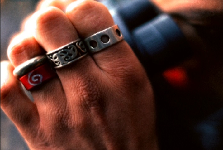 Silver rings on a man's hand; © margaret schnipper, photographer